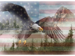 Patriotic scene: a bald eagle with wings spread soaring over pine trees, with a faded US flag and mountains in the background.