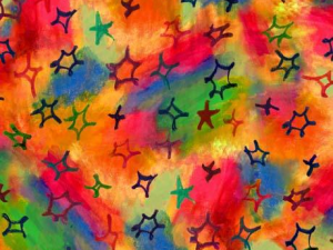 Bright tie-dye pattern in orange, pink, yellow, green, and blue with scattered dark star-like shapes.