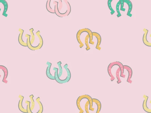 Pastel-colored U-shaped horseshoe doodles scattered on a light pink background, forming a decorative pattern.