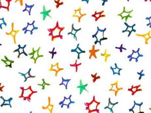Abstract pattern of colorful starburst shapes scattered on a white background, creating a festive confetti-like look.