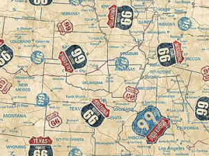Pattern of vintage Route 66 shields over a map, with a ruler at the bottom of the image.